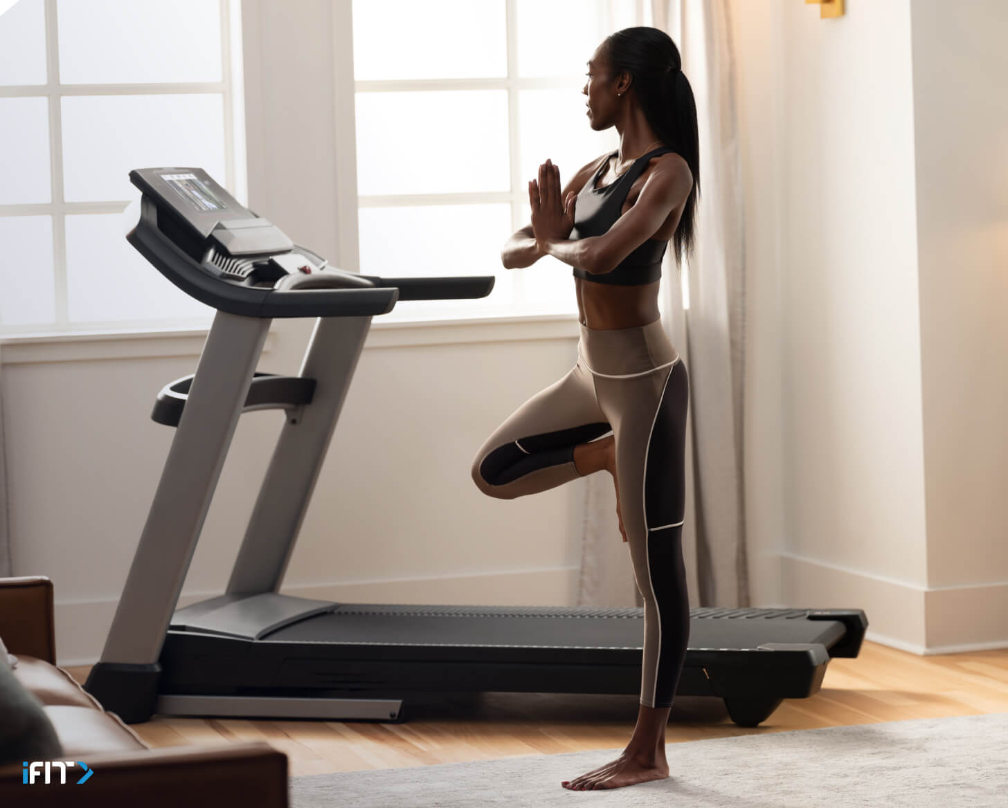 Woman does an iFIT meditation class Woman works out to an iFIT meditation class