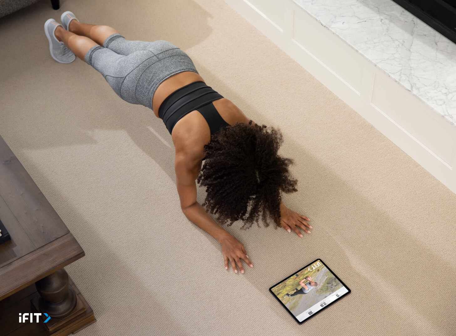 iFIT core exercises Woman does iFIT core exercises during an ab workout