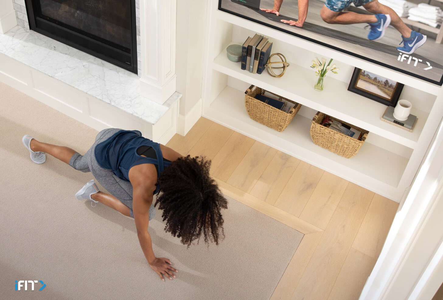 Woman does iFIT full body exercises during a workout