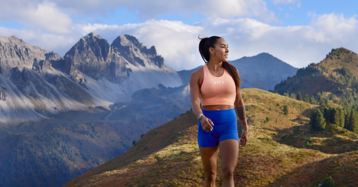 Cinematic alpine scenery from Hannah Eden’s Austrian Alps 12-3-30 Hiking Series on the iFIT fitness app, featuring incline walking workouts designed to build endurance and strength.