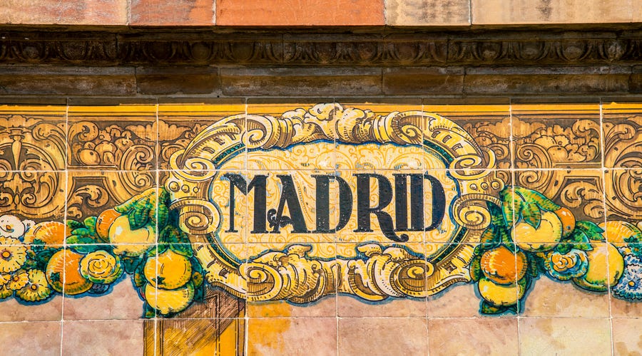 A wall with tiles showing the name Madrid