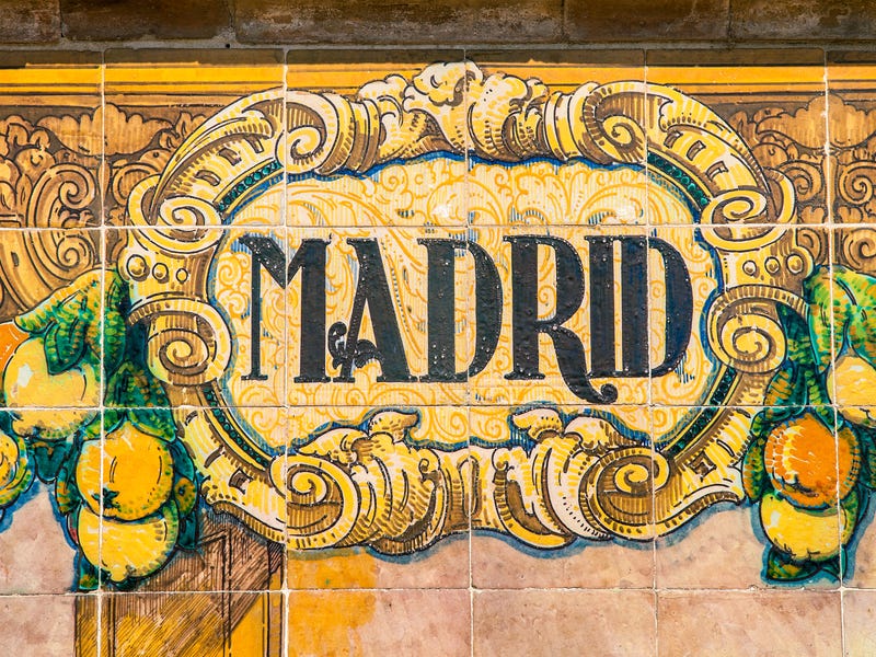 A wall with tiles showing the name Madrid