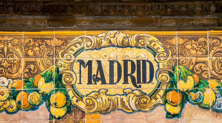 A wall with tiles showing the name Madrid