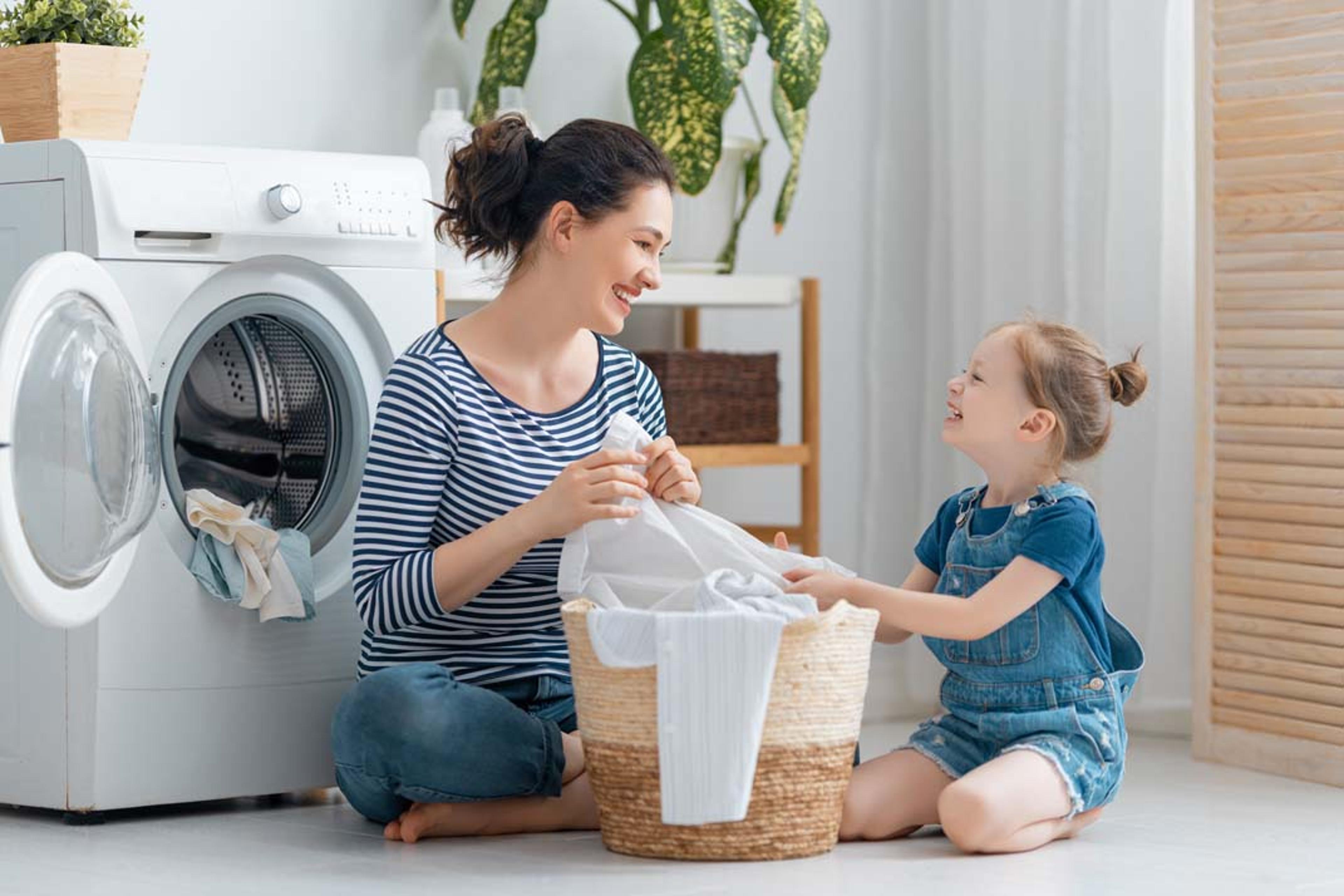 mom and daughter doing laundry