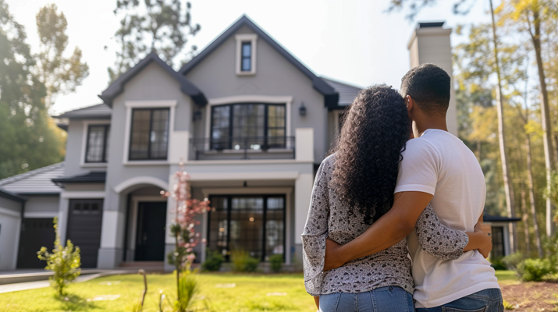 couple standing outside of home