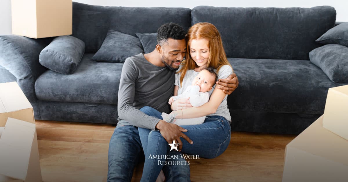 new parents holding baby