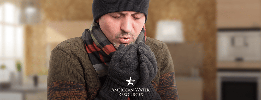 cold homeowner in hat and gloves