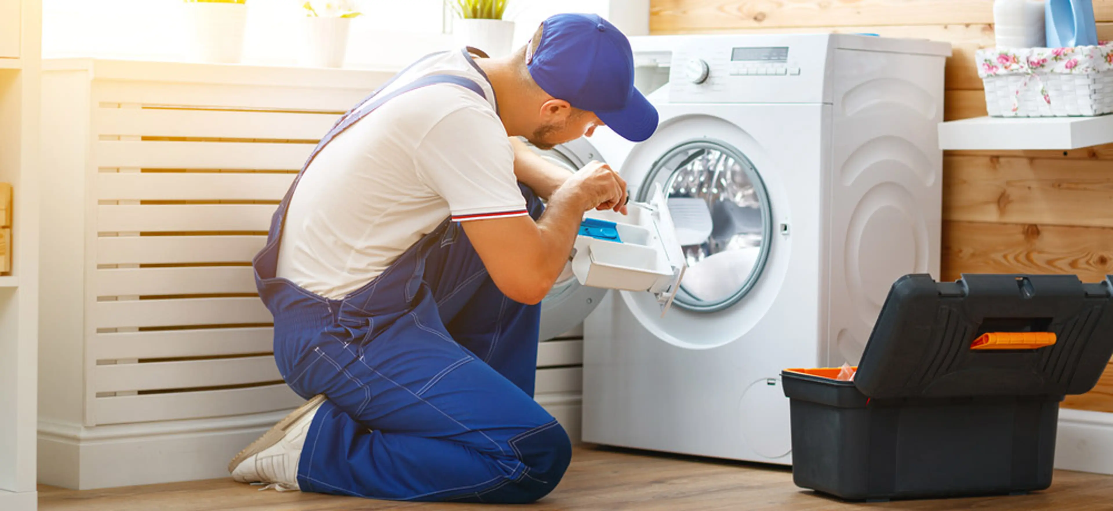 tech working on washing machine