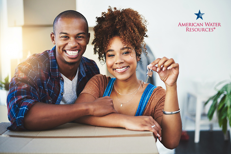 new homeowners holding keys