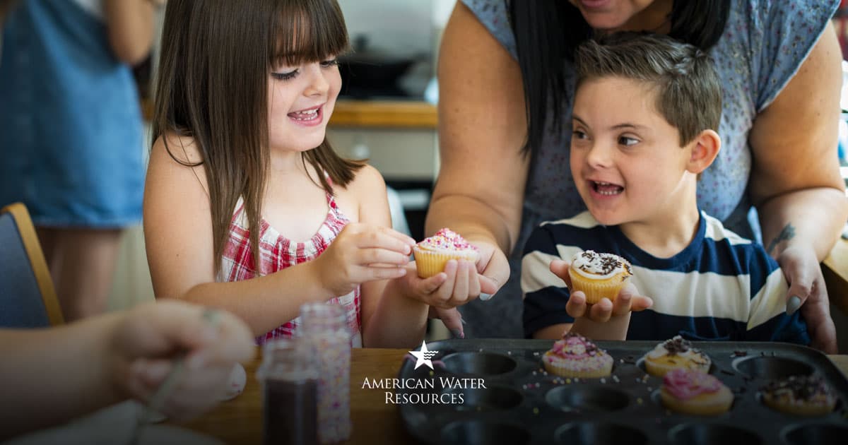 mother and children making cupcakes