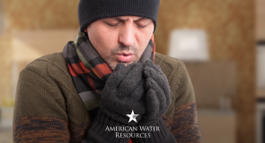 cold homeowner in hat and gloves