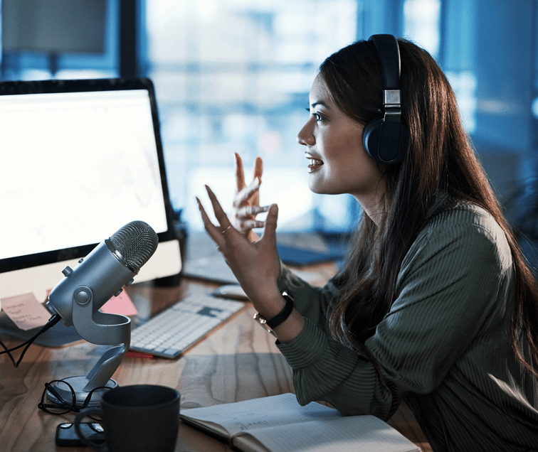 Woman With Headset Talking into Microphone