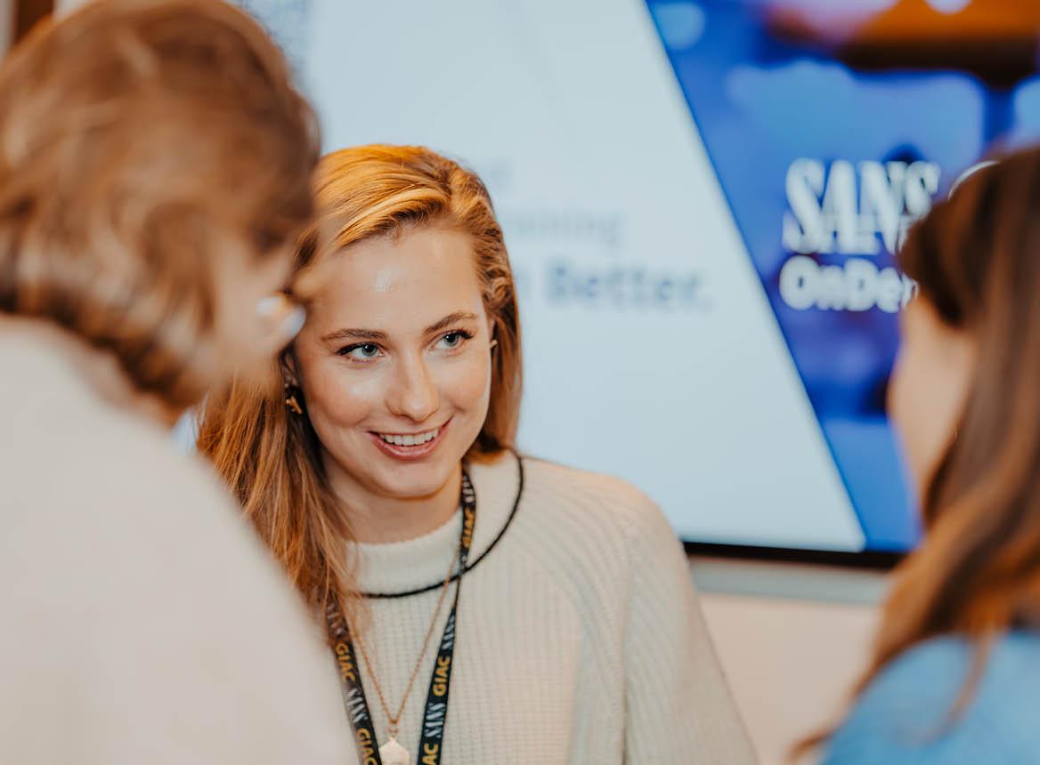 A Woman Smiling at a SANS Event