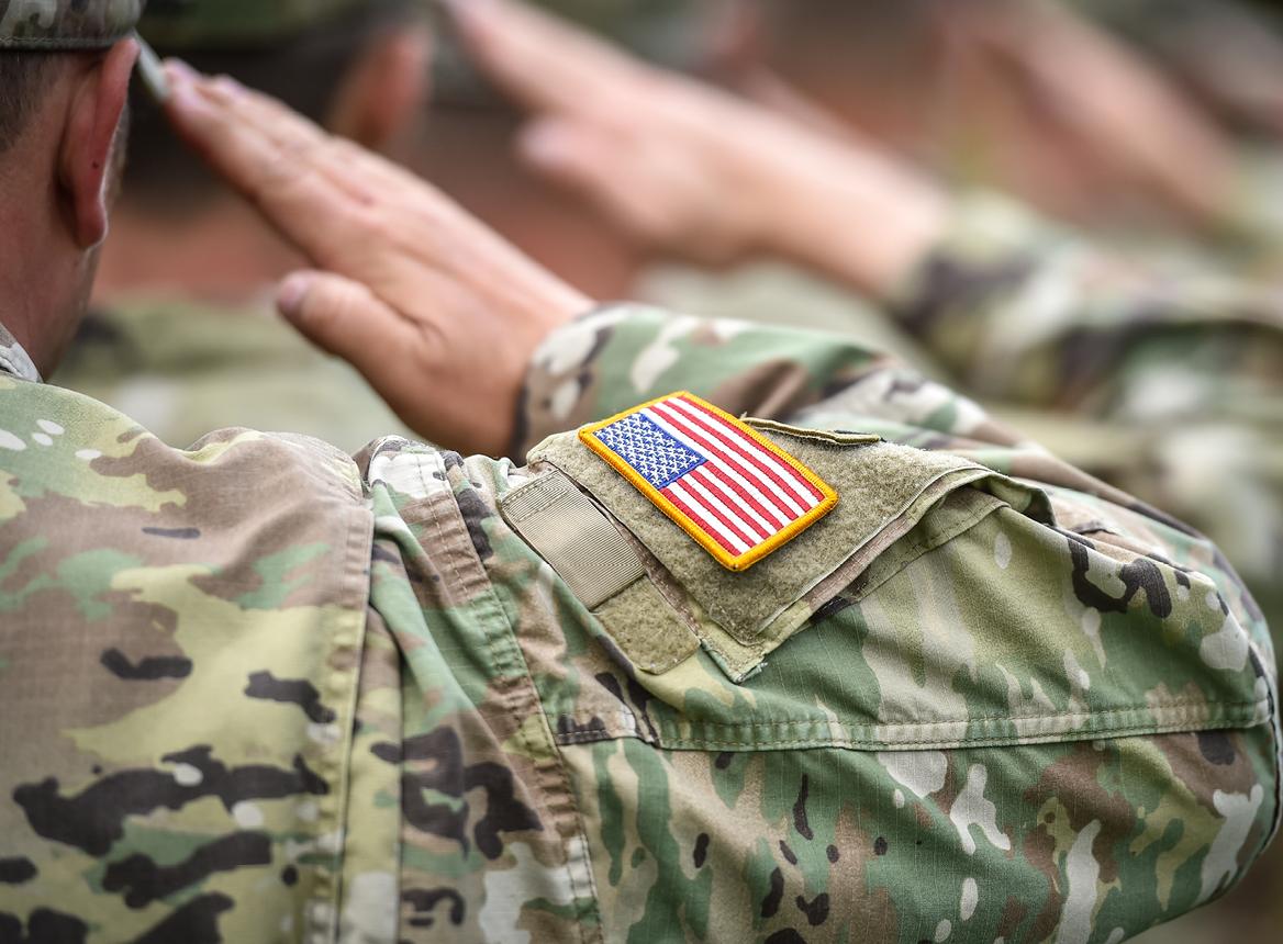 Close Up of Soldiers Saluting and American Flag Patch