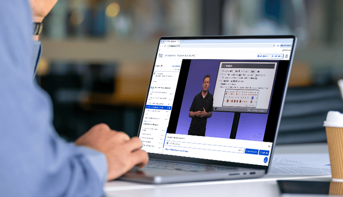 Close Up of Hand and OnDemand Training on Laptop