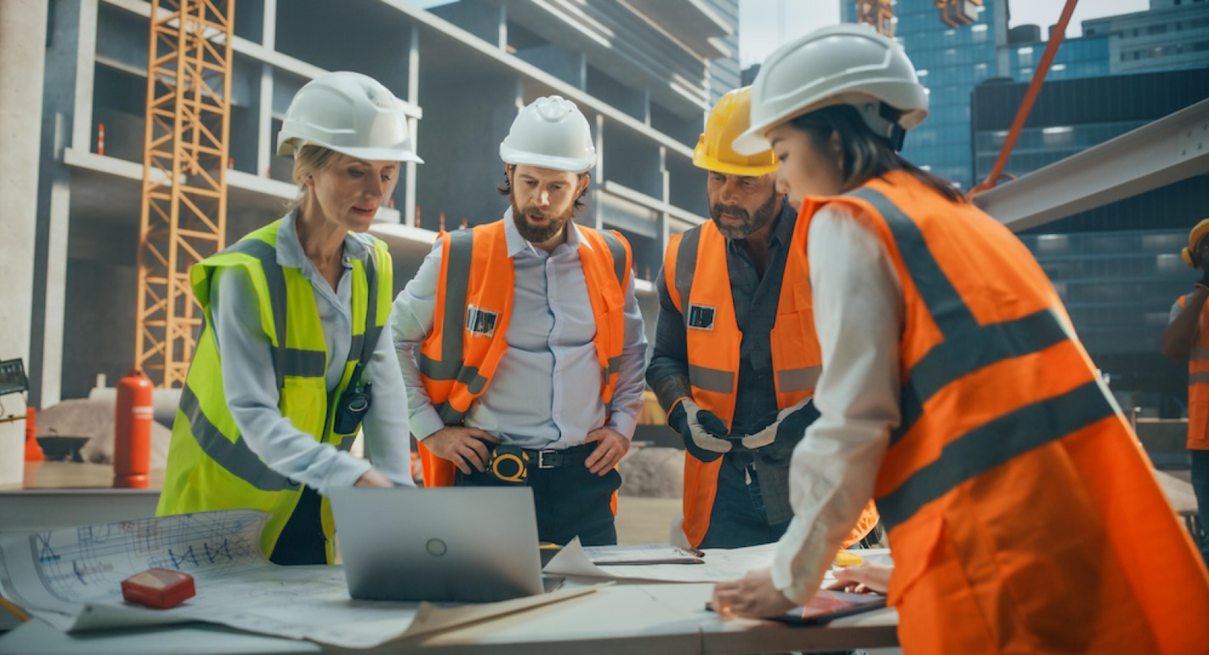 Construction Workers Discussing on a Job Site