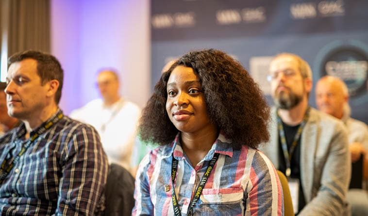 Woman Listening to Lecture at a SANS Event