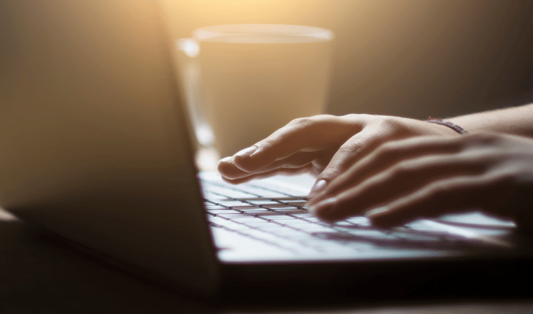 Close Up of Hands on Keyboard