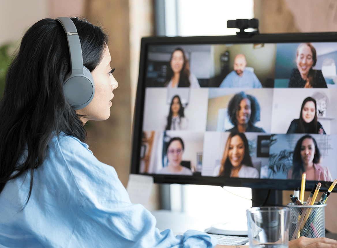 A Woman Sitting On an Online Meeting