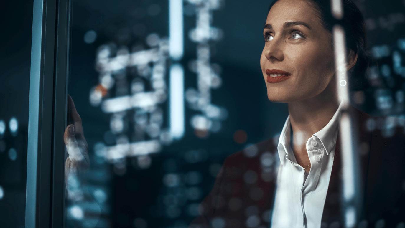 Woman Looking Out a Window at Night
