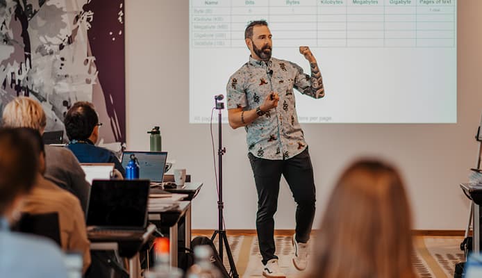 Rich Greene: Teacher Explaining a Concept in a Classroom