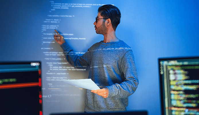Person Pointing at Text on Smartboard Projector Running Across Body and Face
