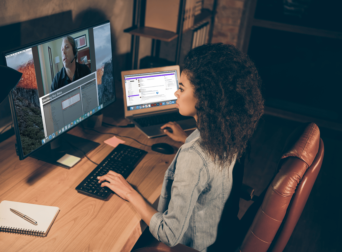 Woman at Desk at Home Listening to an Ondemand Course