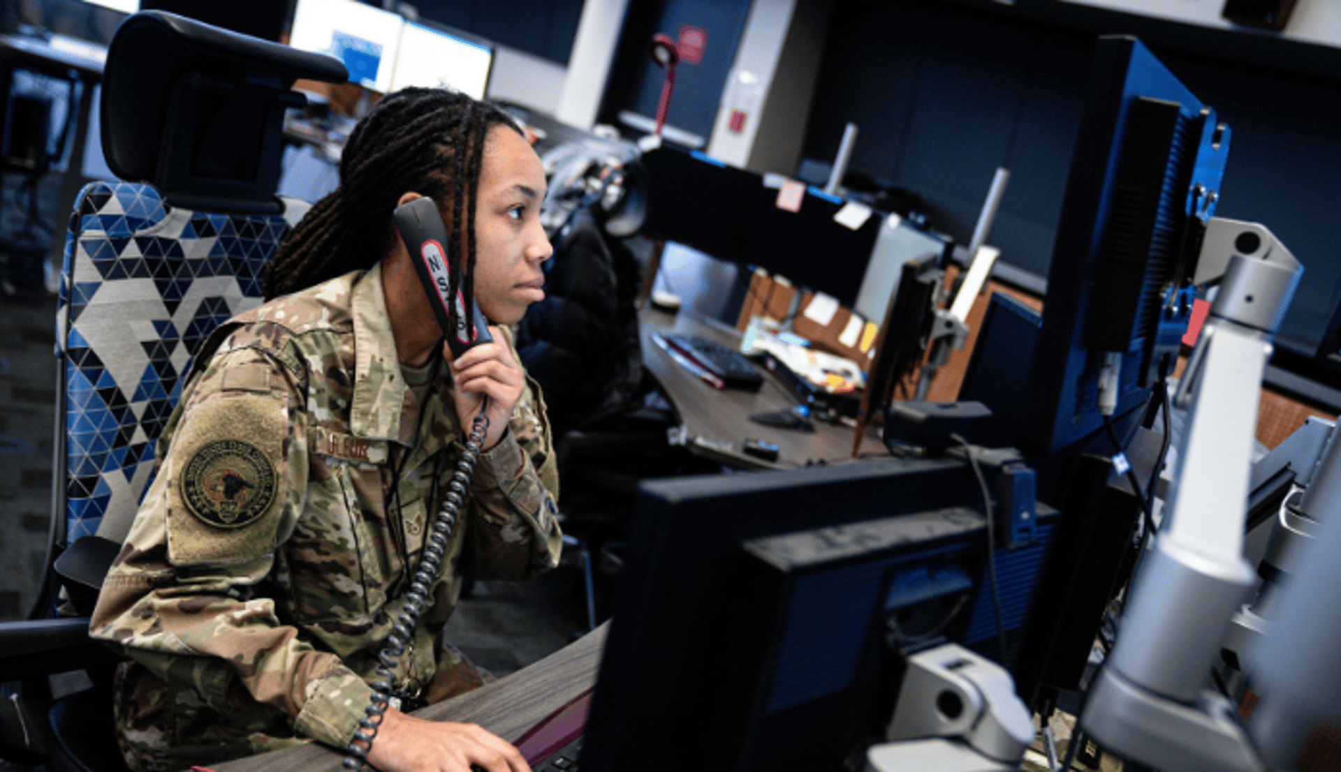 Woman Soldier Talking on the Phone in Office