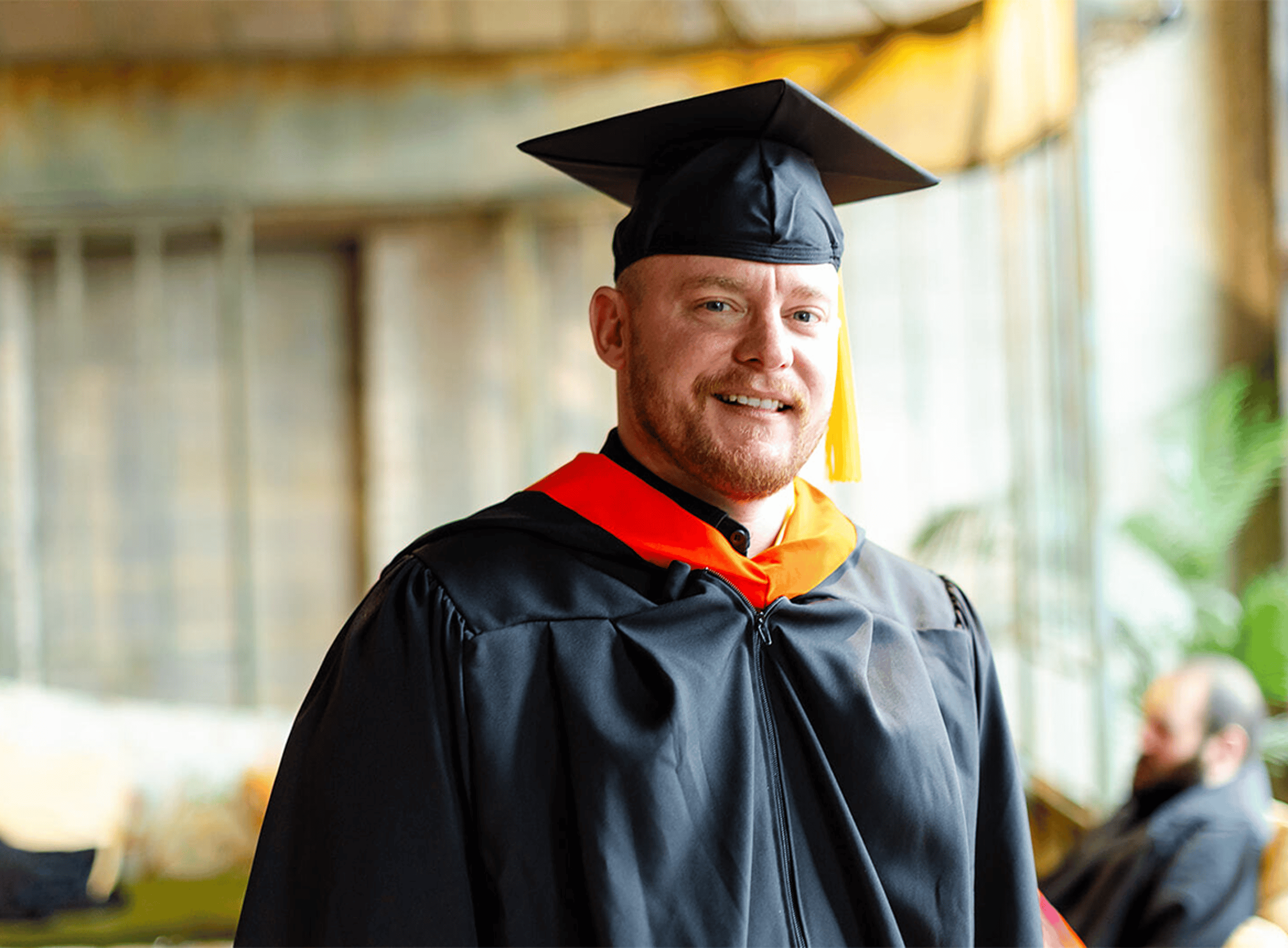 Split Content: Graduate at Grad Ceremony: 1168x860