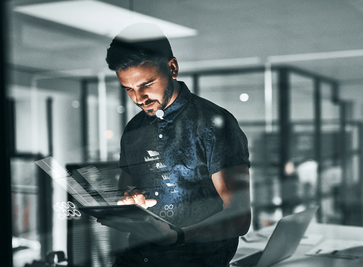 Man Using Tablet While Icons Hover in the Air