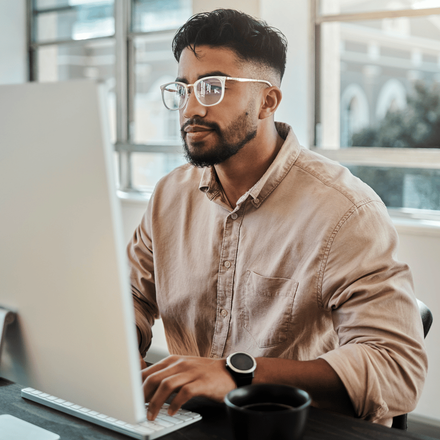 Man With Glasses at Laptop