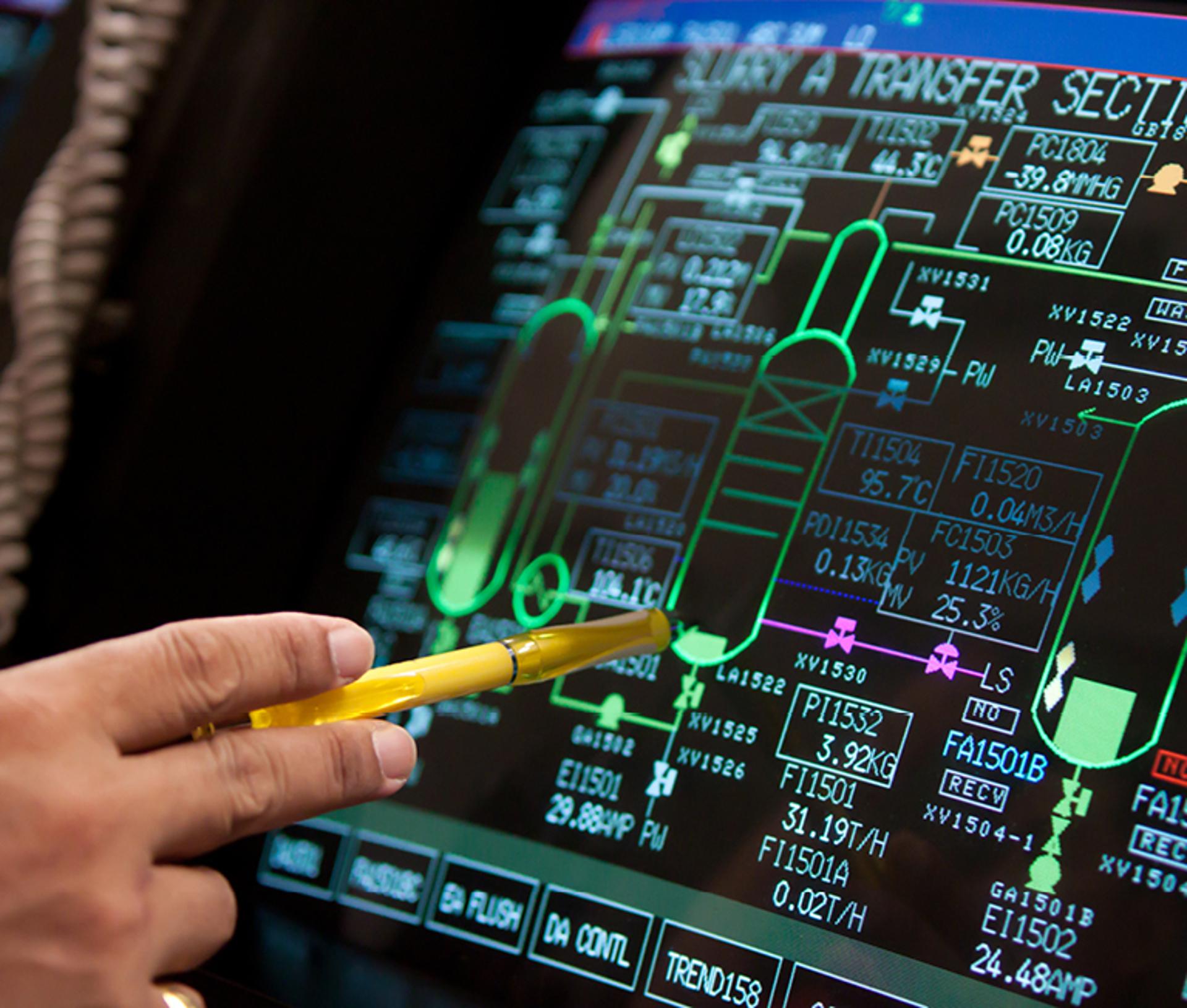 Hand holding a pen pointing at a ICS screen