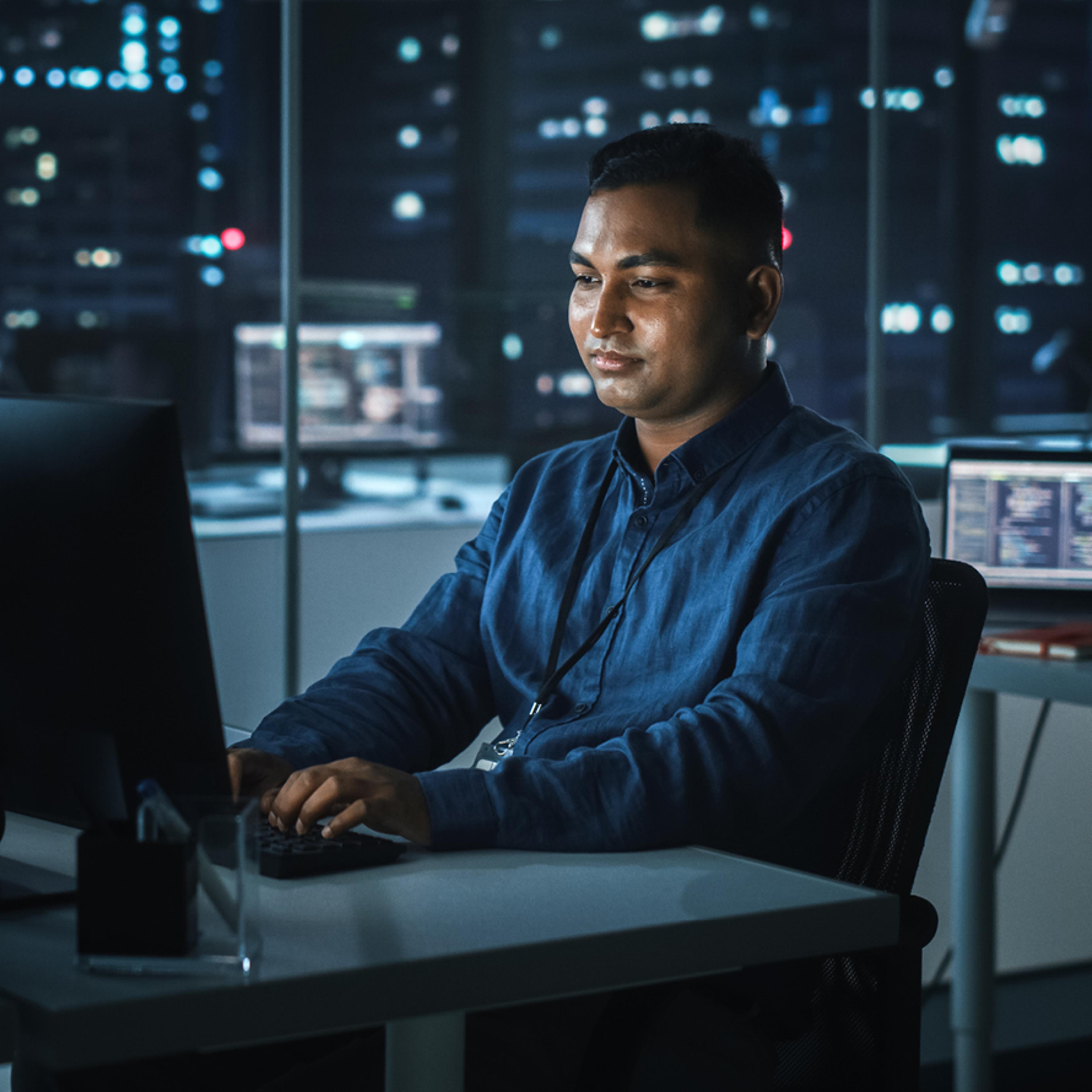 Indian Man Working in Office at Night