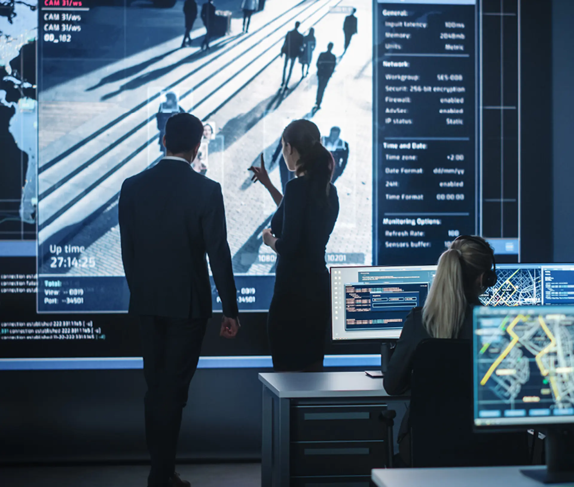 People in front of a large screen
