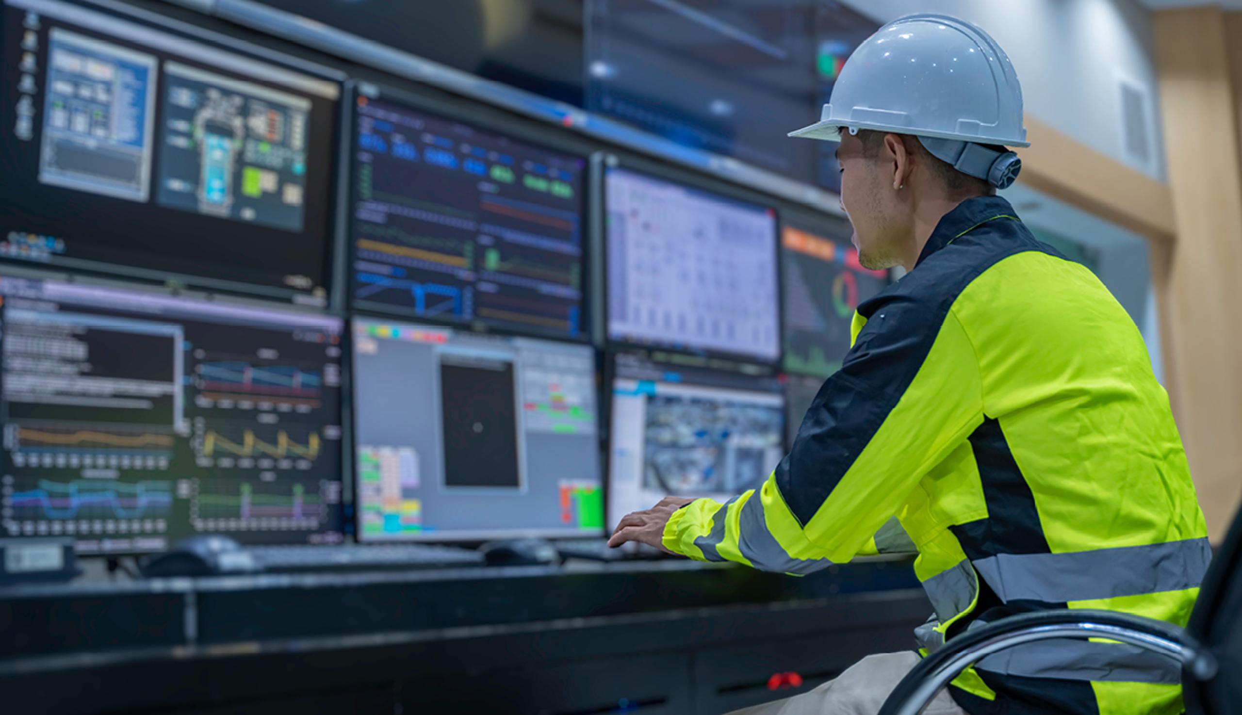 Worker looking at screens