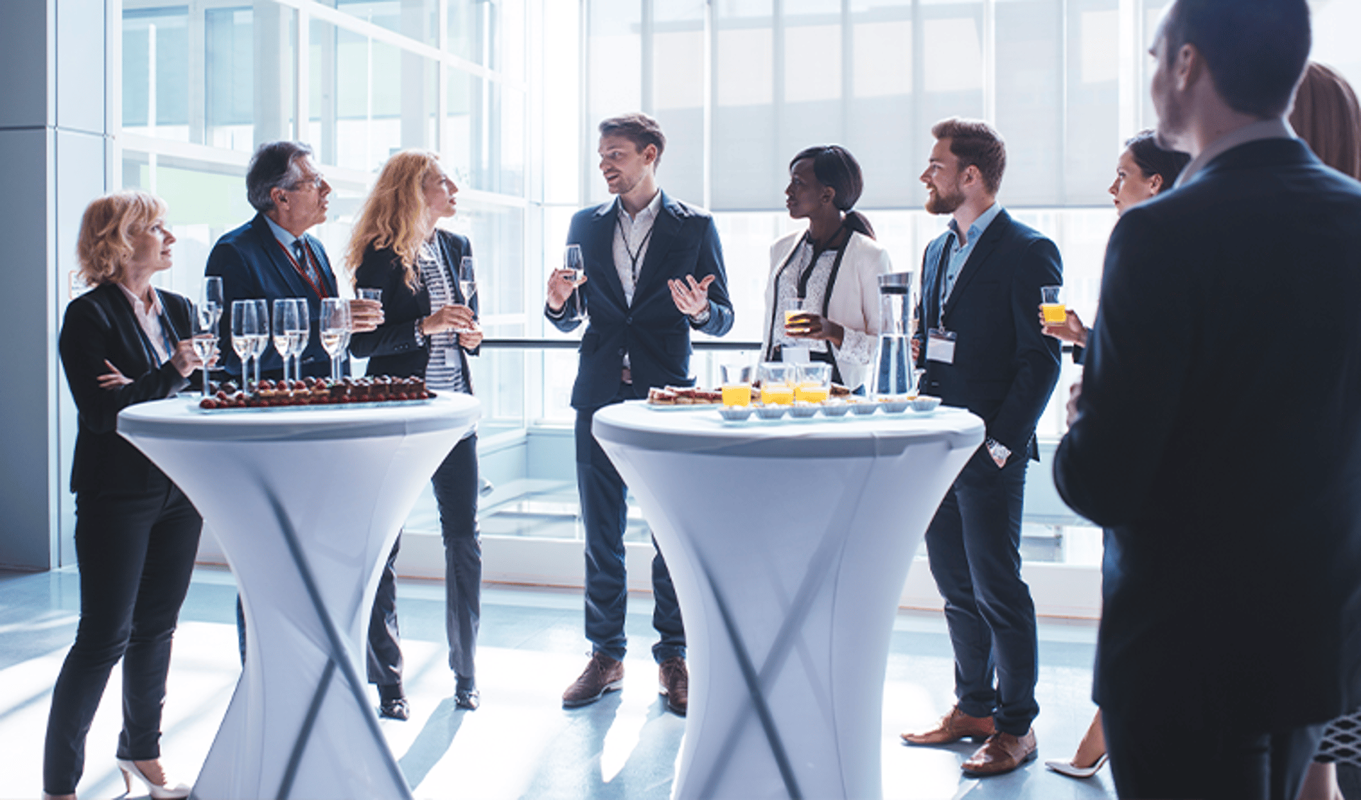 Group of People Socializing at Breakfast Bar