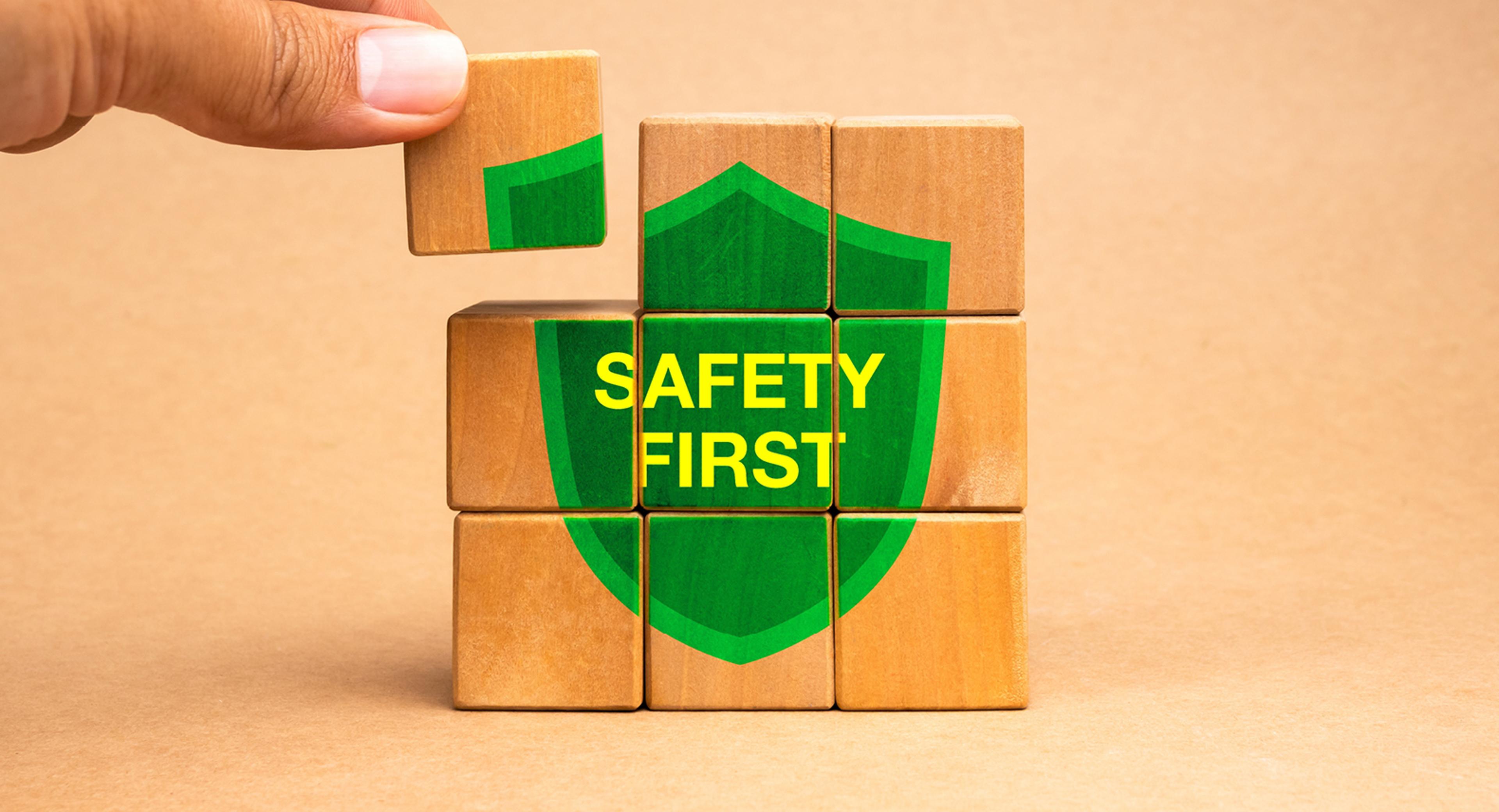 A hand stacking blocks