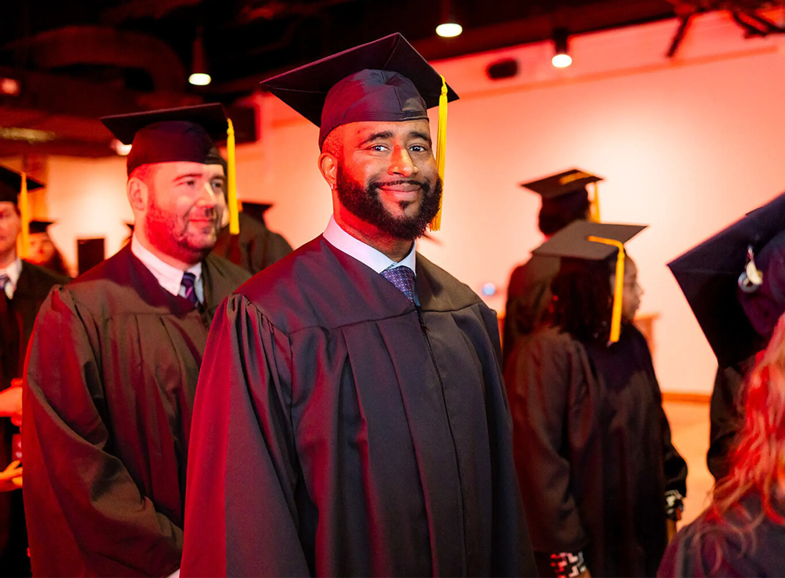 Smiling graduates at graduation