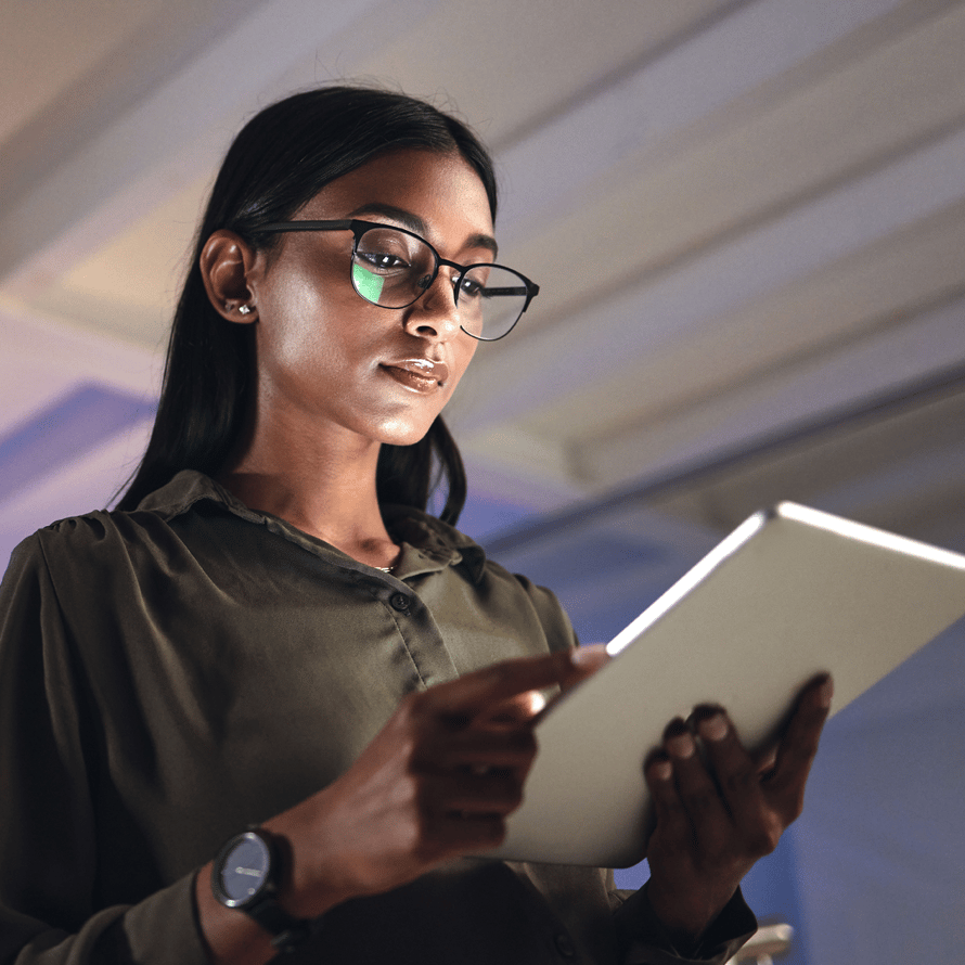 Close Up of Woman Staring Intently at a Tablet