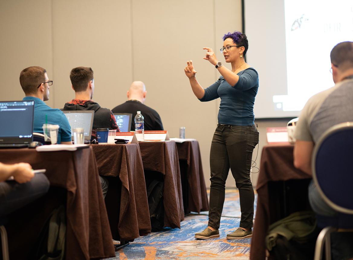 Lodrina Cherne: A Teacher Explaining A Concept in A Classroom