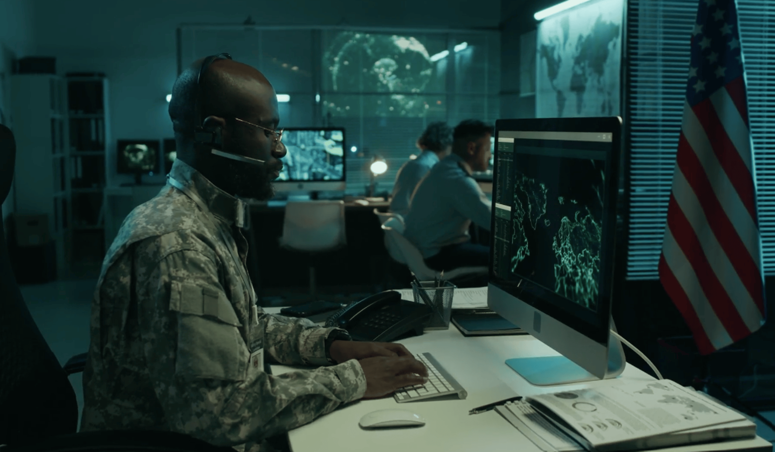 Soldier in a SOC typing on a keyboard