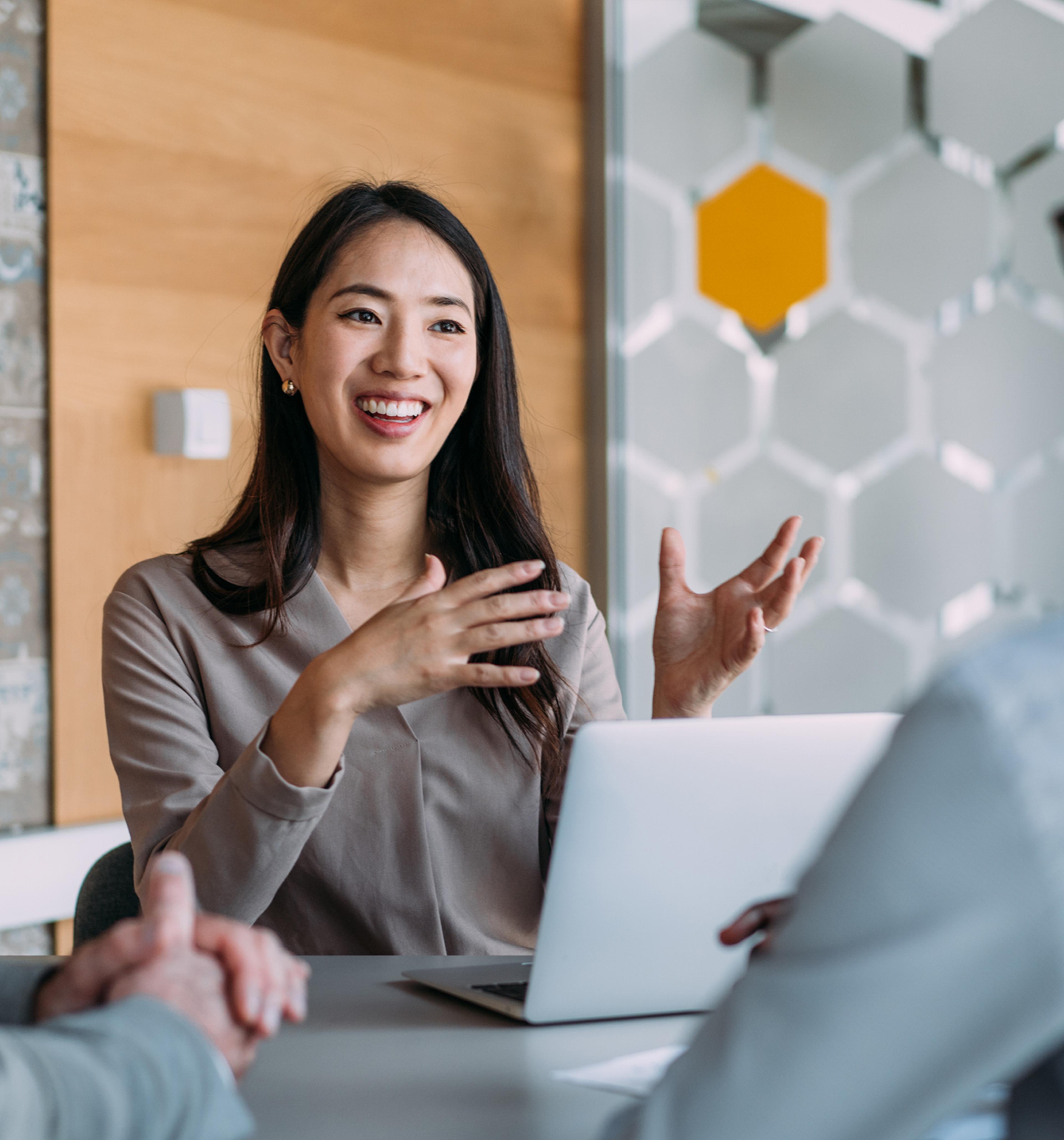 Woman Explaining a Concept in a Meeting