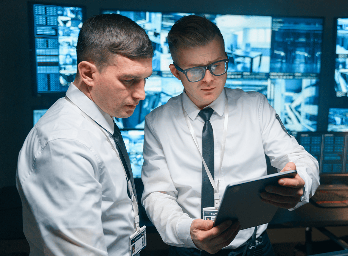 Two People Looking at Tablet