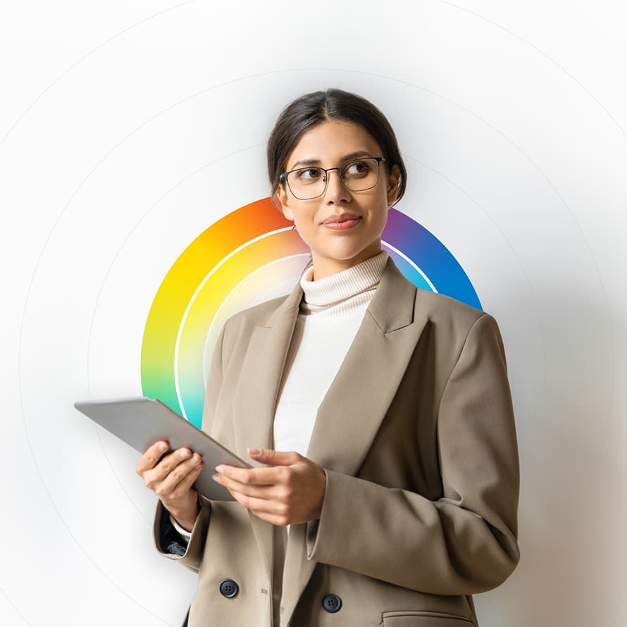 A Woman Looking Off Camera with Rainbow Circles Behind Her