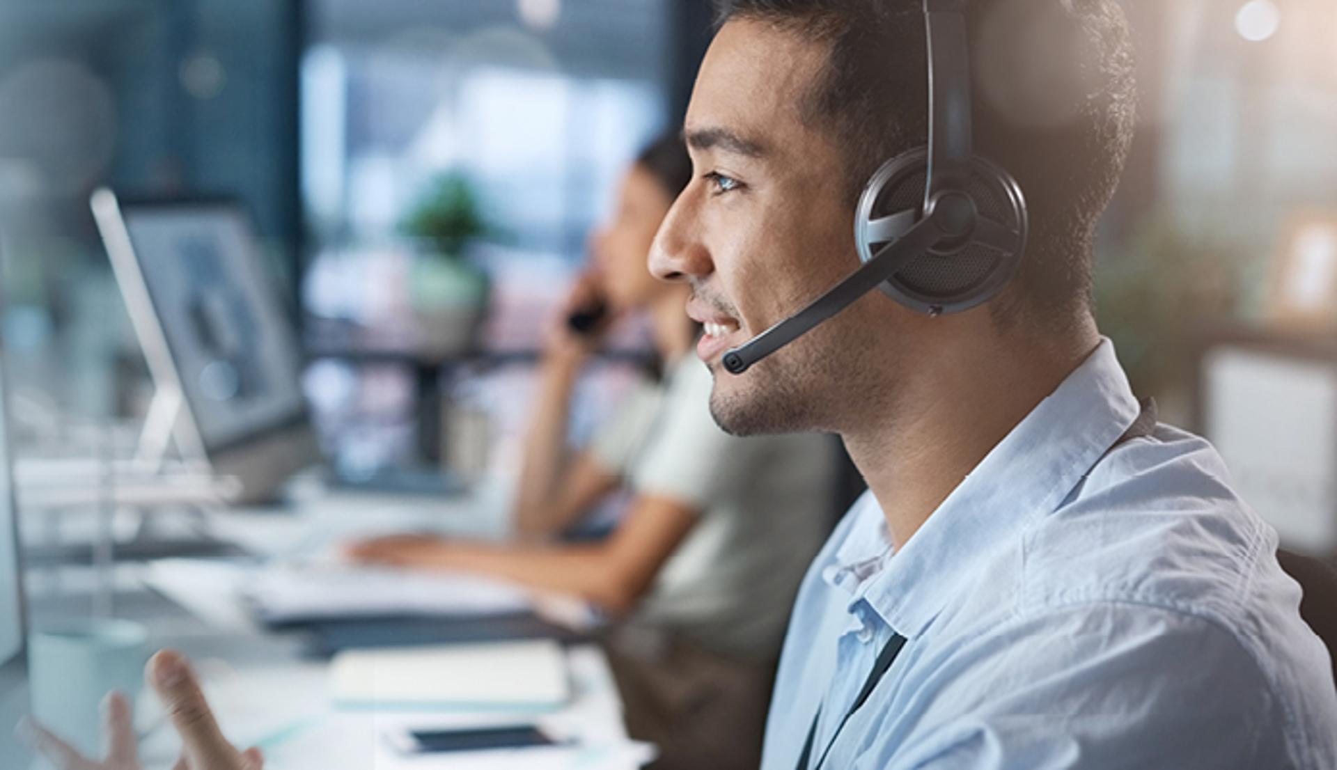 Smiling Customer Service Man Wearing Headphone and Mic
