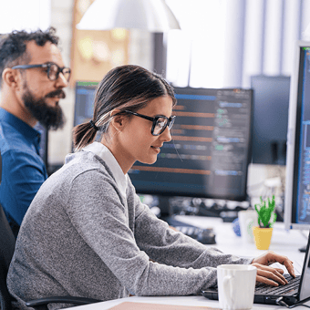 Two Office Workers at Their Desk