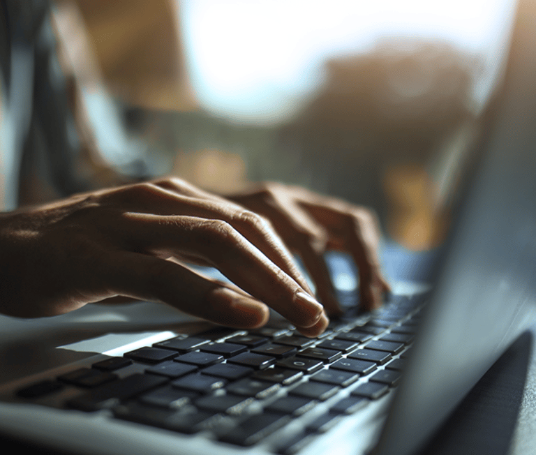 Person Typing on Computer