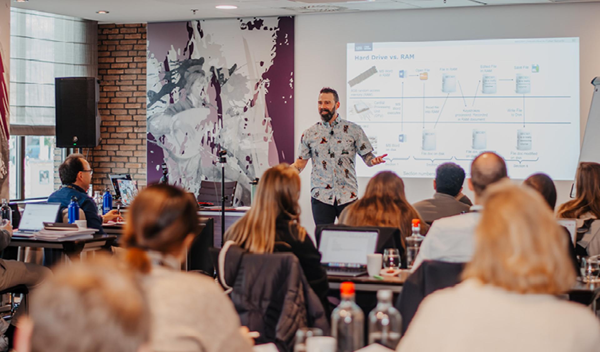 Rich Greene: Teacher Smiling While Explaining a Concept
