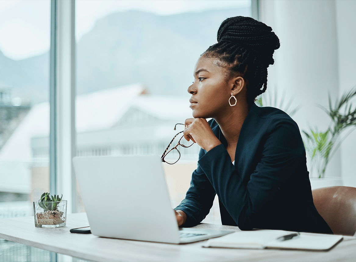 Serious Woman Thinking While Holding Her Glasses