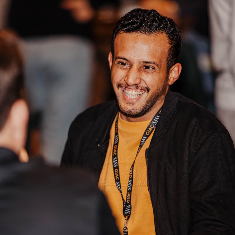 Smiling Man Attending a SANS Event